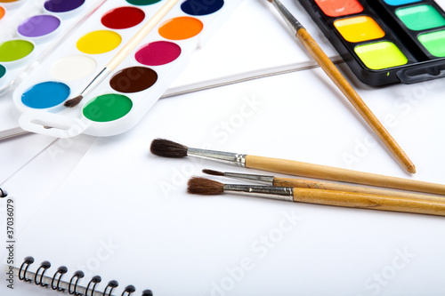 Water colour paints brush albums for drawing on a table