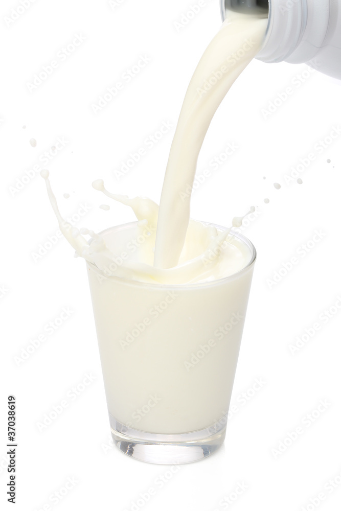 Bottle pouring milk into a glass. Splash Bottle pouring milk into a glass. Splash
