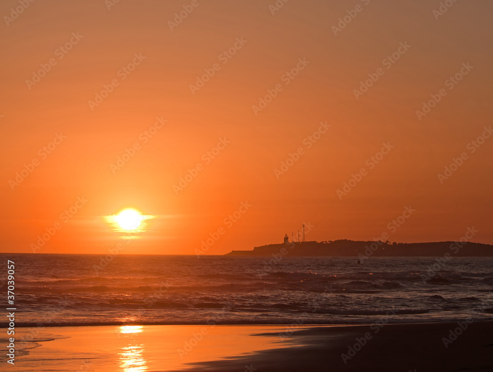 Sea and lighthouse at sunset, Spain