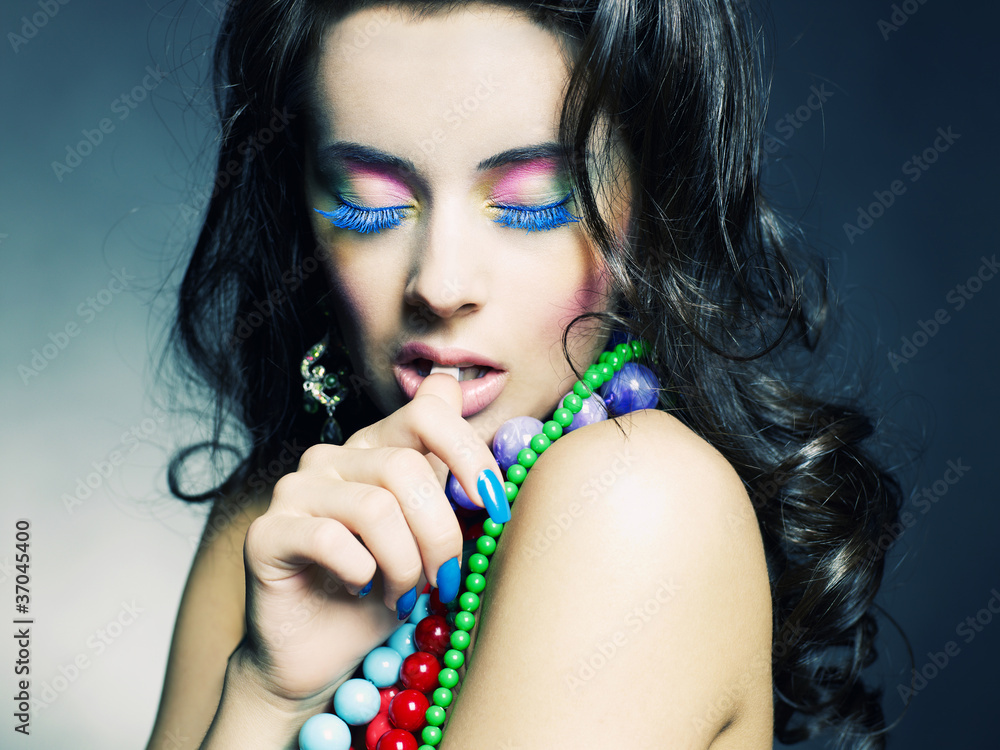 Young beautiful girl with bright beads