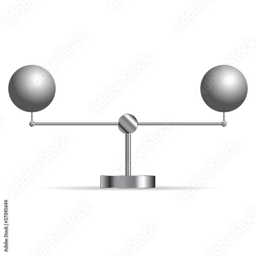Two metallic spheres supported in a cradle over white