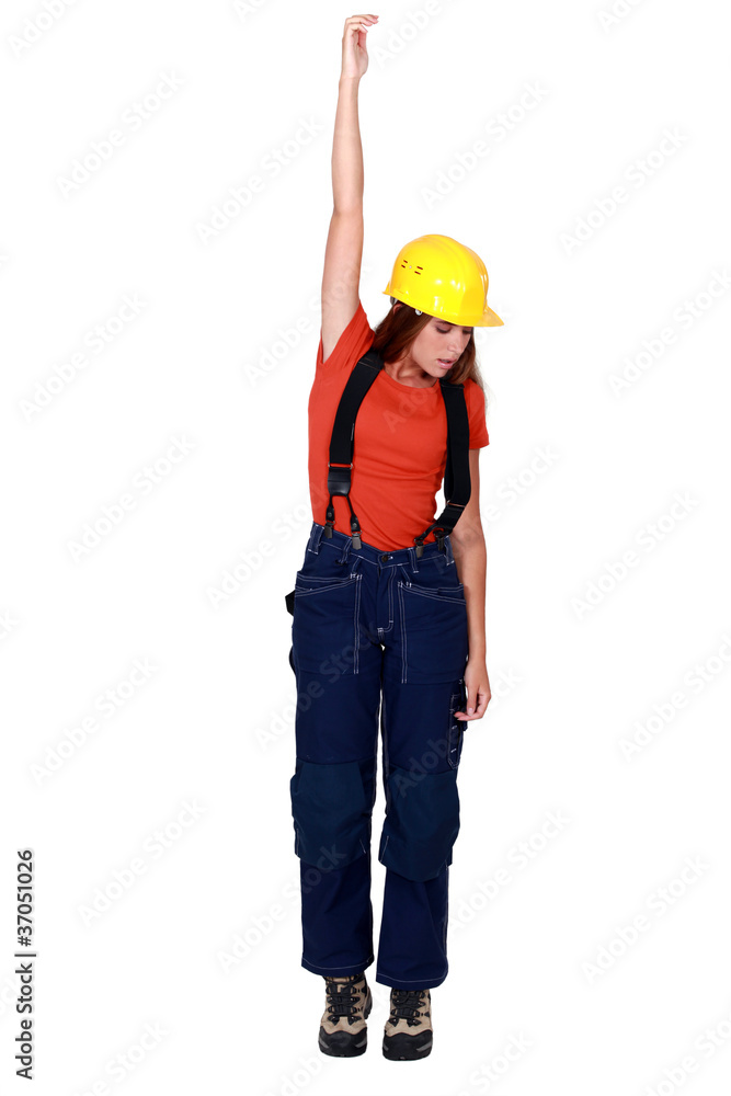 Tradeswoman being pulled up by an invisible object Tradeswoman being pulled up by an invisible object