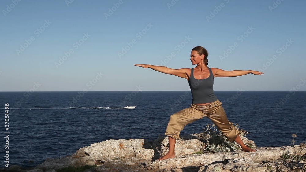 Woman doing a yoga exercise Woman doing a yoga exercise