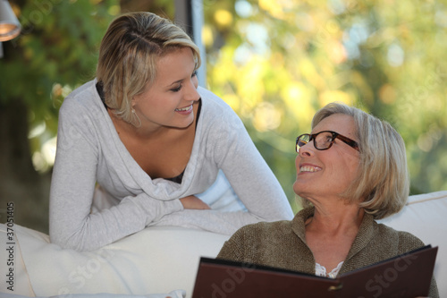 Vászonkép Young woman spending time with her grandmother