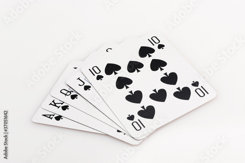 Royal flush of spade on white background