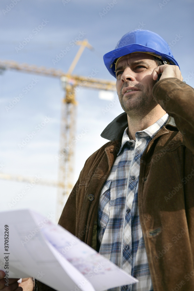 Foreman stood in front of crane Foreman stood in front of crane