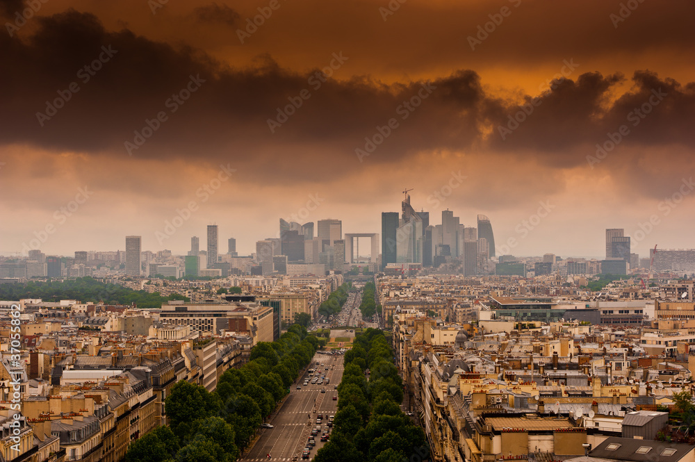 image with dramatic clouds over the Champs Elysees in Paris