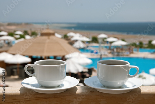 Coffee cups near sea