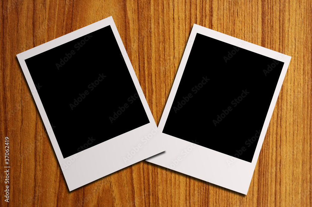 blank photos on a wood background blank photos on a wood background