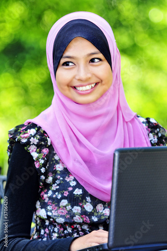A Young Muslim Women with a laptop