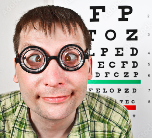 person wearing spectacles in an office at the doctor photo