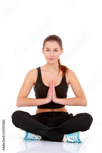 Portrait of pretty young woman doing yoga © Dash