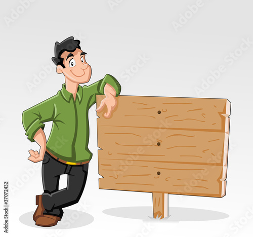 Young man and wood billboard with empty space