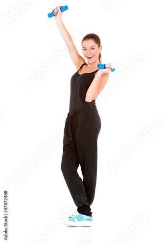 Fitness woman working out with dumbbells on white