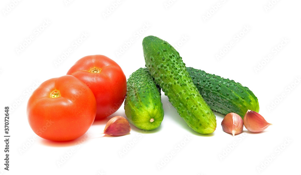 tomatoes, cucumbers and garlic on a white background tomatoes, cucumbers and garlic on a white background