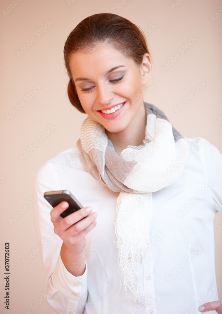 Brunette woman using mobile phone Brunette woman using mobile phone