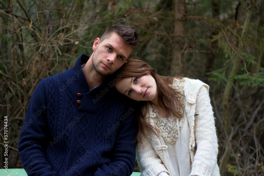 Fototapeta premium Young couple in the forest head on head