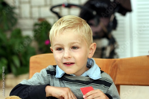 Boy plays a board game