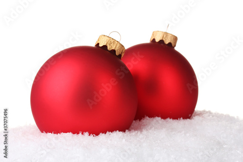 beautiful red Christmas ball in snow isolated on white