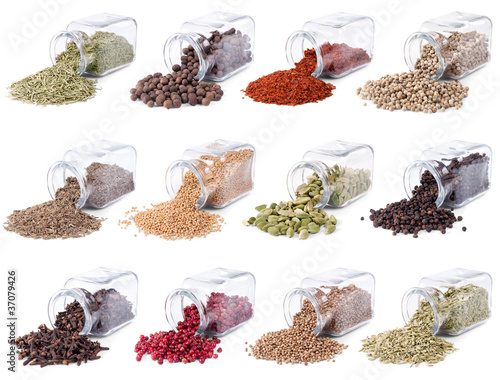 Fototapeta Naklejka Na Ścianę i Meble -  Spices and herbs are scattered on a white background