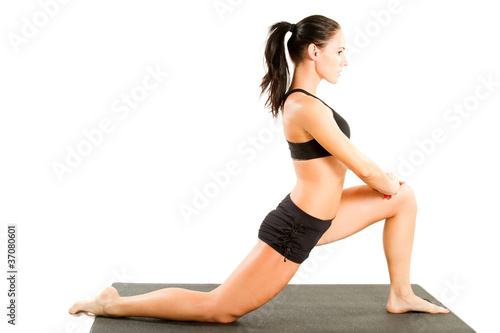 woman in sports bra on yoga pose on isolated