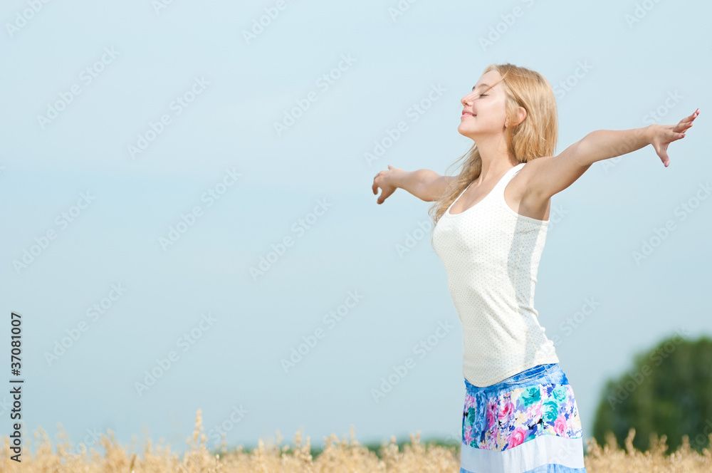 Happy woman on picnic in wheat field Happy woman on picnic in wheat field