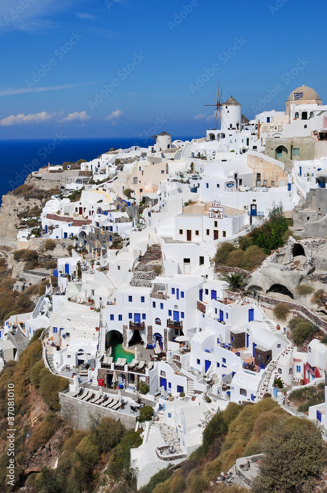 Amazing view of Oia and it's blue doors and windmill