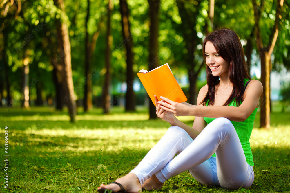 woman reading book and smiling