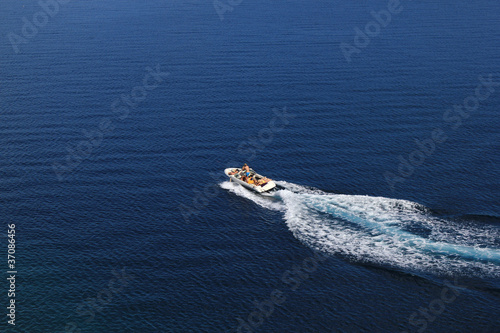 Speed boat aerial view on blue sea © xbrchx
