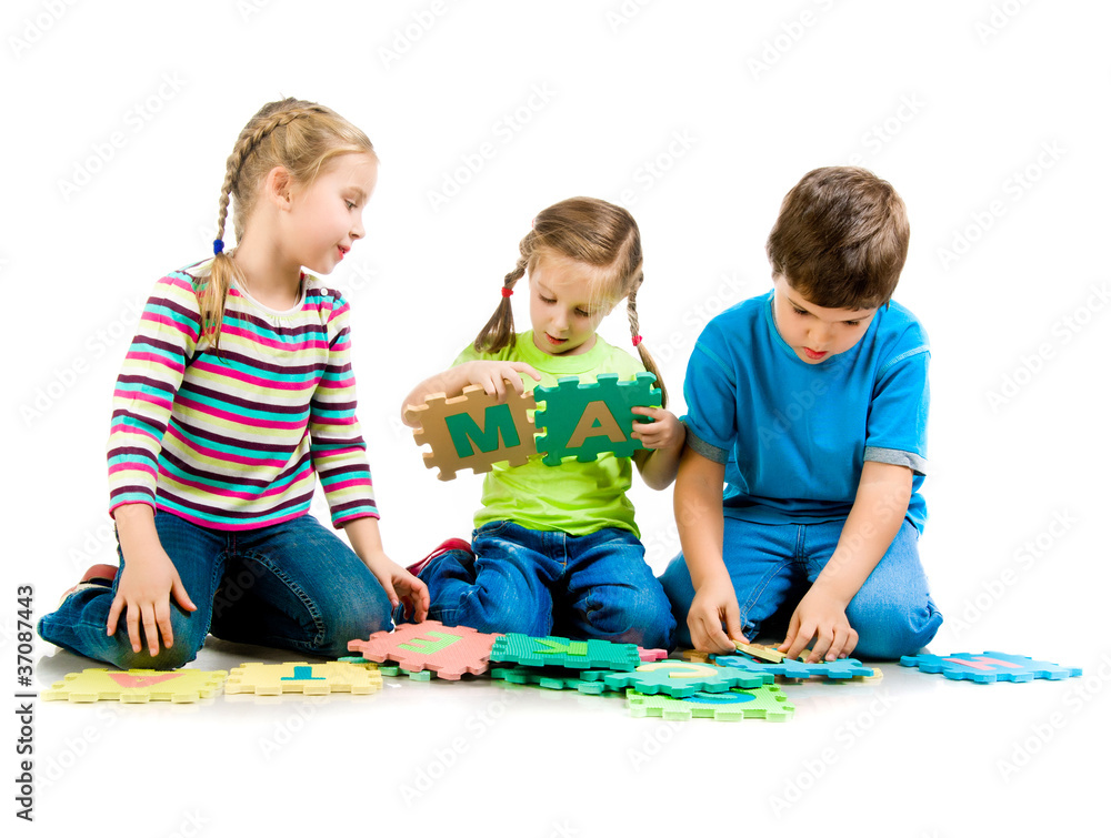 children are playing letters