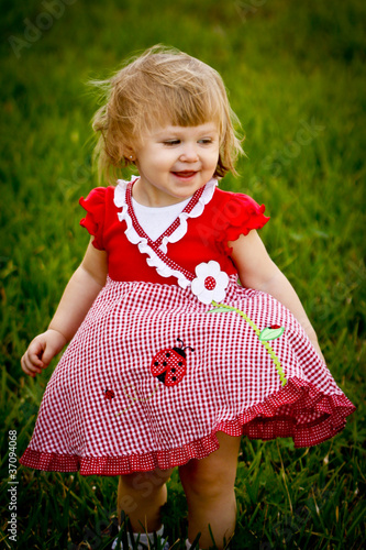 Girl Smiling in Grass Field