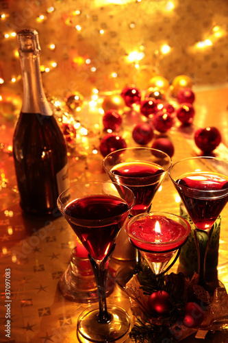 Closeup of red wine and candle lights.