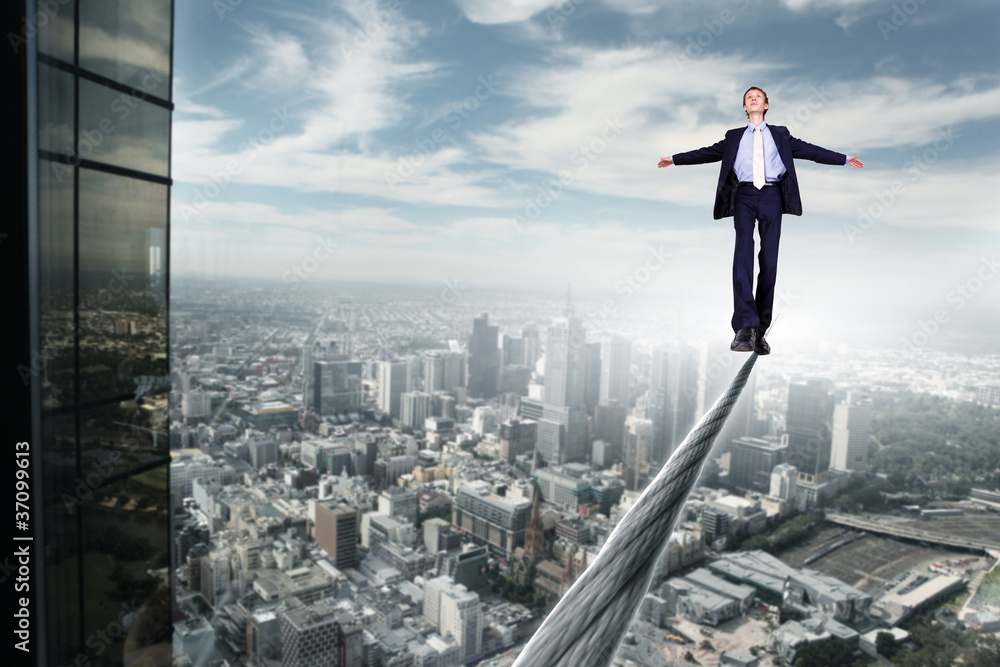 Business man balancing on the rope Business man balancing on the rope