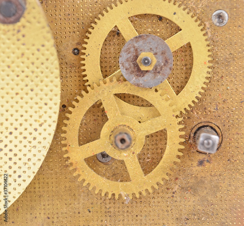 Inside the clock (watchwork), antique vintage clock mechanism photo