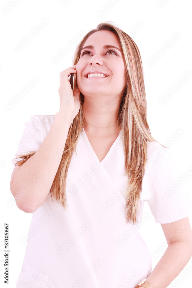 Medical professional talking on her mobile phone Medical professional talking on her mobile phone