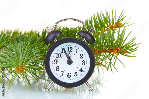 Green Christmas tree and clock isolated on white