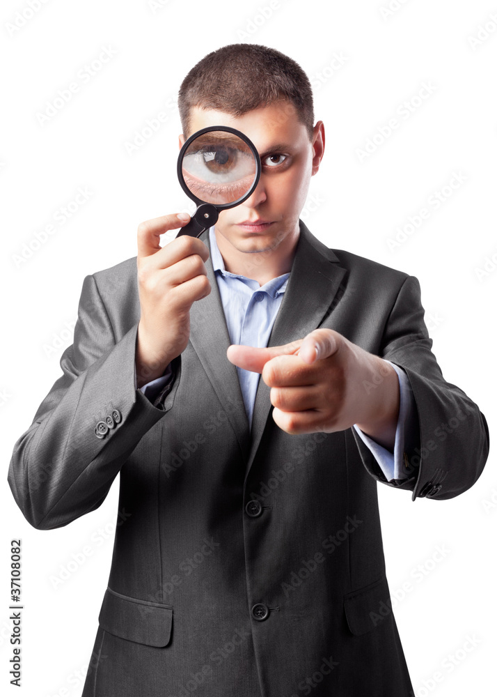 businessman in a suit looking through a magnifying glass isolate businessman in a suit looking through a magnifying glass isolate