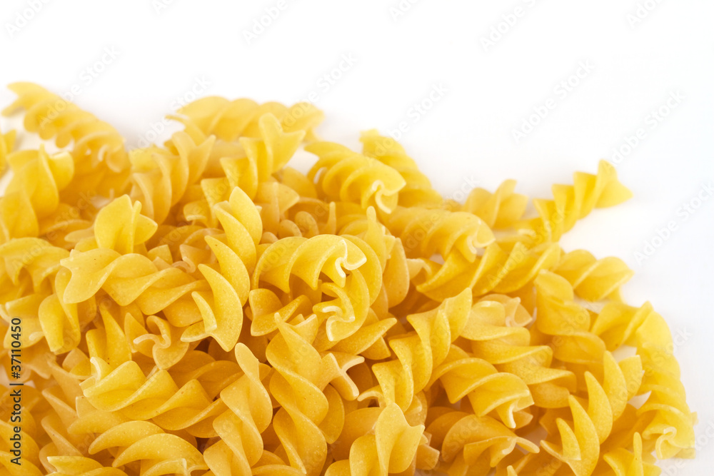close up of a dried italian pasta on white background close up of a dried italian pasta on white background