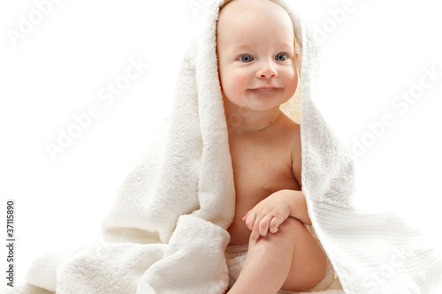 Baby in towels on a white background