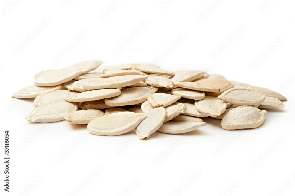 Pumpkin seeds on the white background Pumpkin seeds on the white background