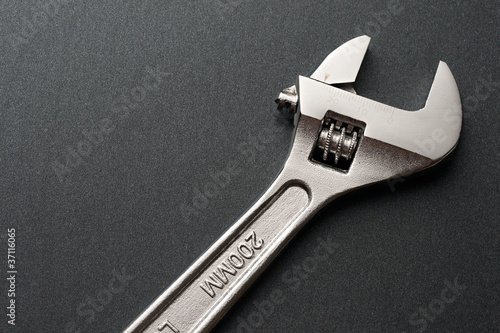 Spanner on a grey background