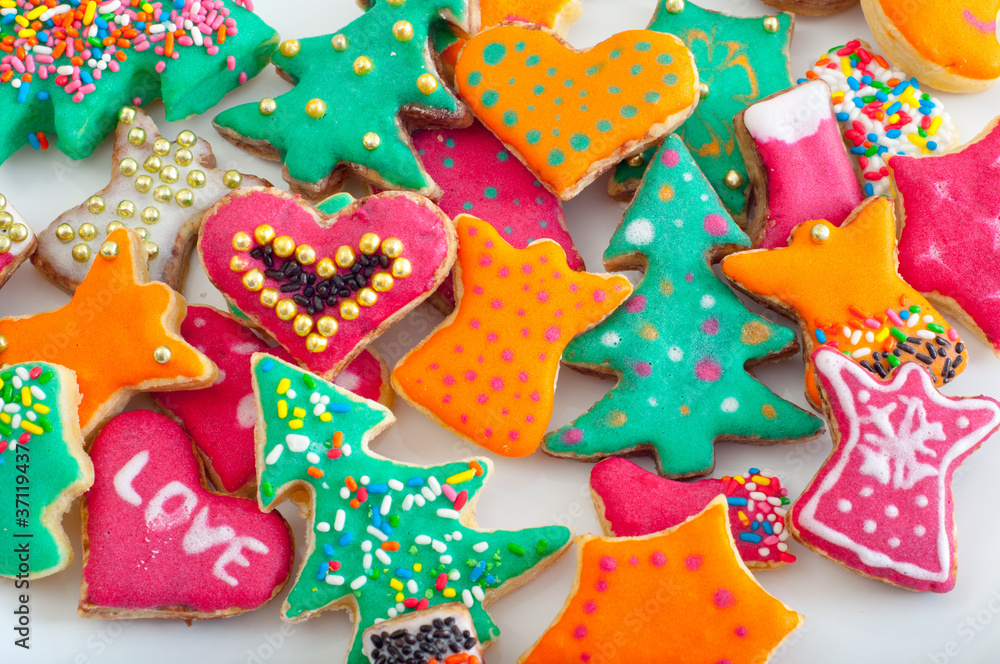 Beautifully decorated pile of cookies on the white plate Beautifully decorated pile of cookies on the white plate