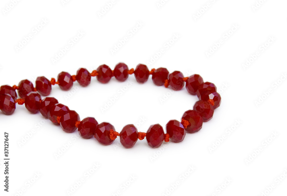 Necklace made of red beads isolated on white Necklace made of red beads isolated on white