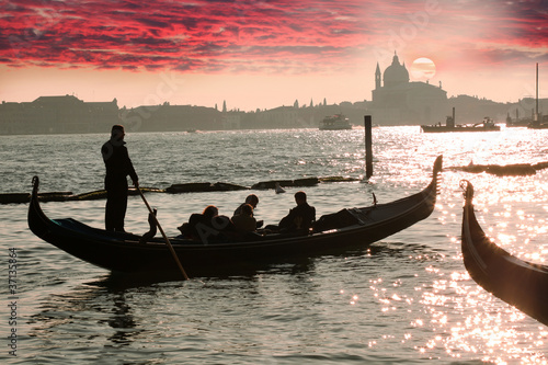 Venice, Gondola against colorful sunrise, Italy © Tomas Marek