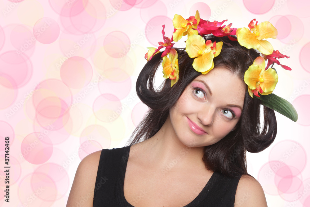 Young brunette with flowers on head