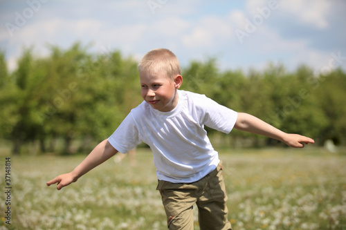 little boy playing in the park