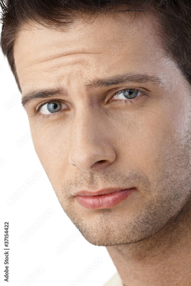 Fototapeta premium Portrait of frowning guy