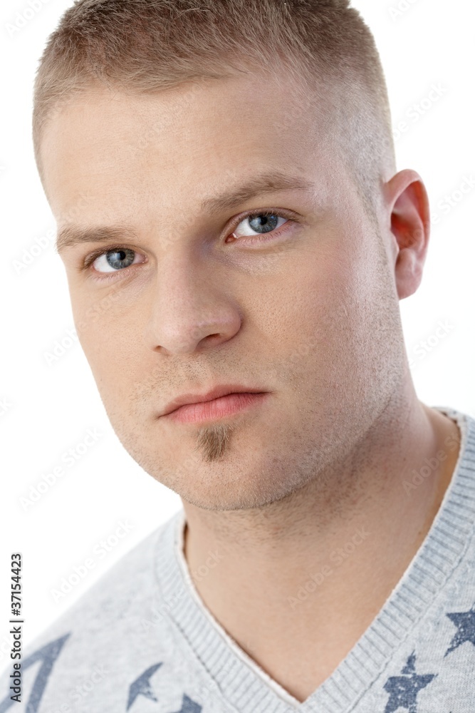 Obraz premium Closeup portrait of young serious man