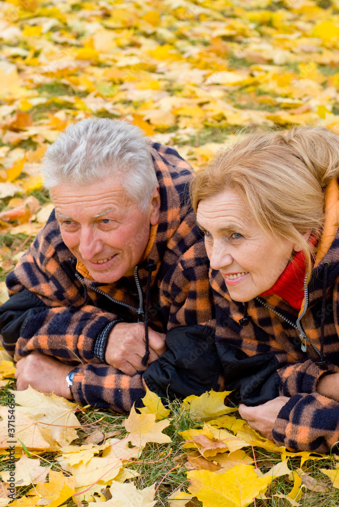 old couple lying on leaves old couple lying on leaves