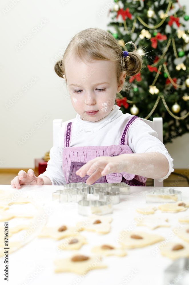 little cute girl making Christmas cookies little cute girl making Christmas cookies